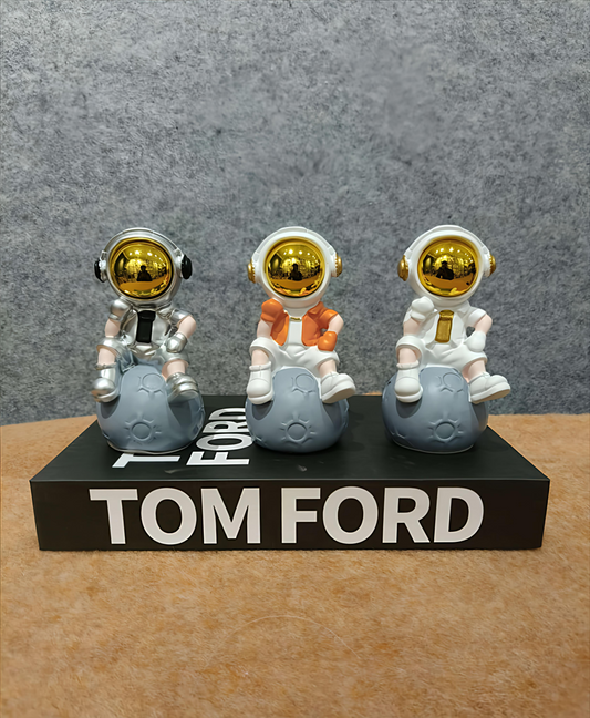 Cute Astronaut Figurine Set – Moon Sitting Astronauts with Golden Helmets (7 x 13 CM)